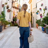 Golden rod puff-sleeve blouse in a soft cotton blend with a gathered waist and relaxed fit.