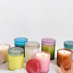 group shot of all joli jar candles sitting in sand