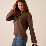 Espresso brown long sleeve ruffle henley top in a lightweight knit fabric.