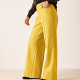 Mustard yellow wide-leg 5-pocket jeans in a linen-blend fabric with topstitching details.