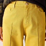 Mustard yellow 5-pocket relaxed-fit denim jeans with front and back pockets.