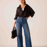 Women's travel-friendly indigo blue wide-leg denim jeans with a relaxed fit.