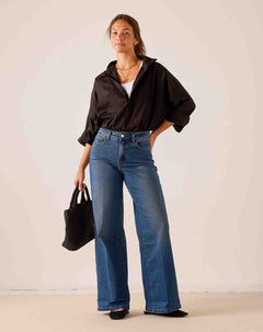 Women's travel-friendly indigo blue wide-leg denim jeans with a relaxed fit.