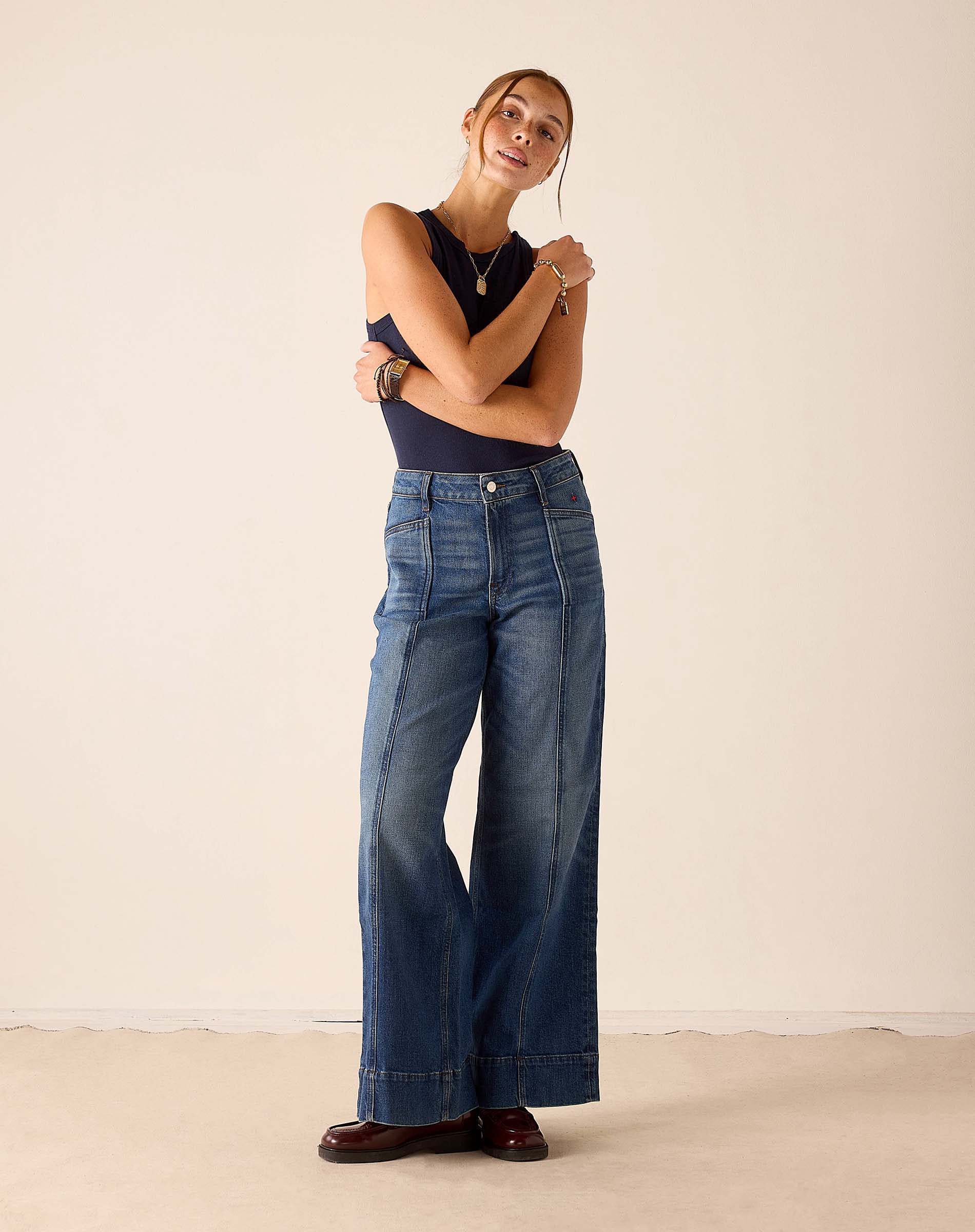 MERSEA women's travel-friendly deep pacific blue wide-leg denim pants with a raw hem and button fly.