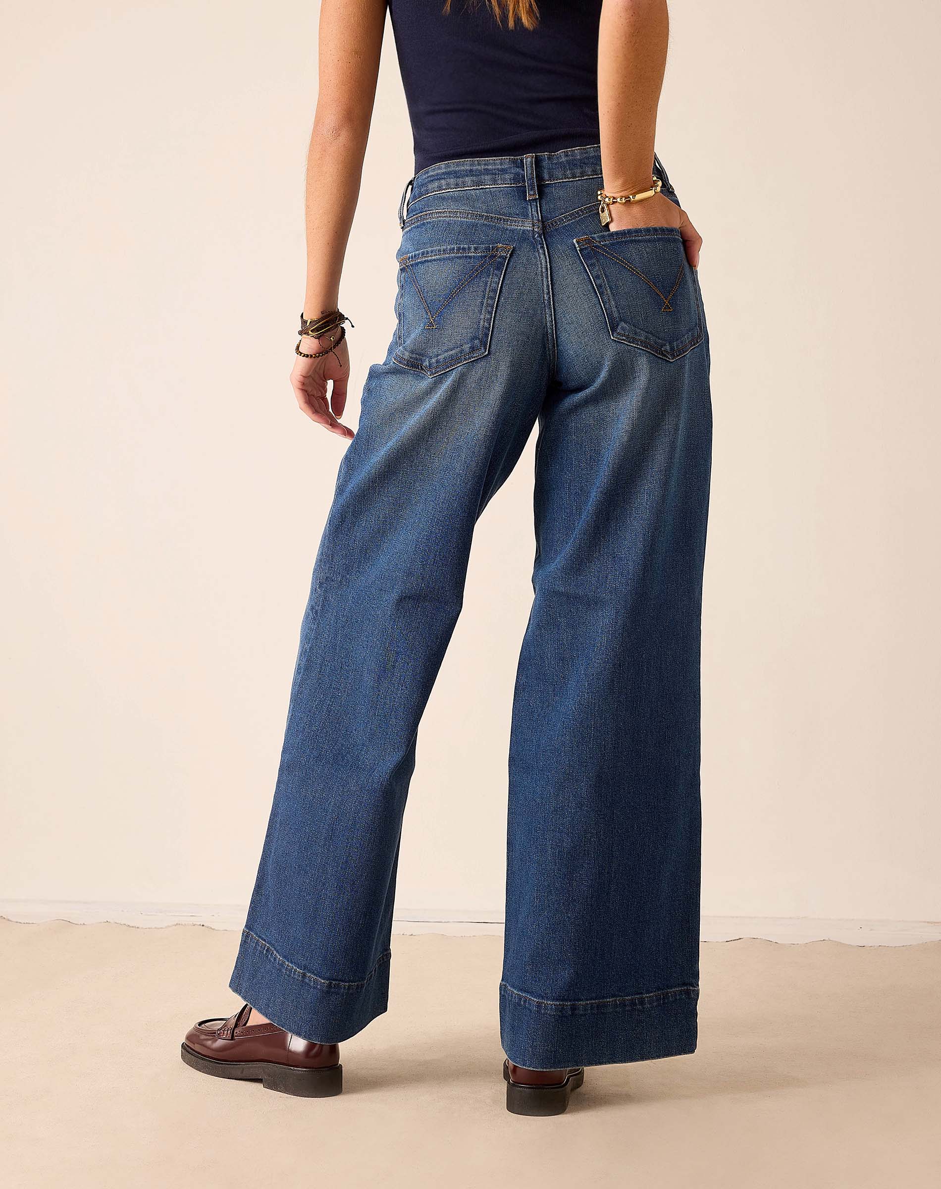 Deep pacific blue wide-leg jeans featuring a relaxed fit and denim construction.