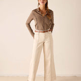 MERSEA ladies' travel-ready oat-colored wide-leg linen trousers with a subtle crease and matching belt.