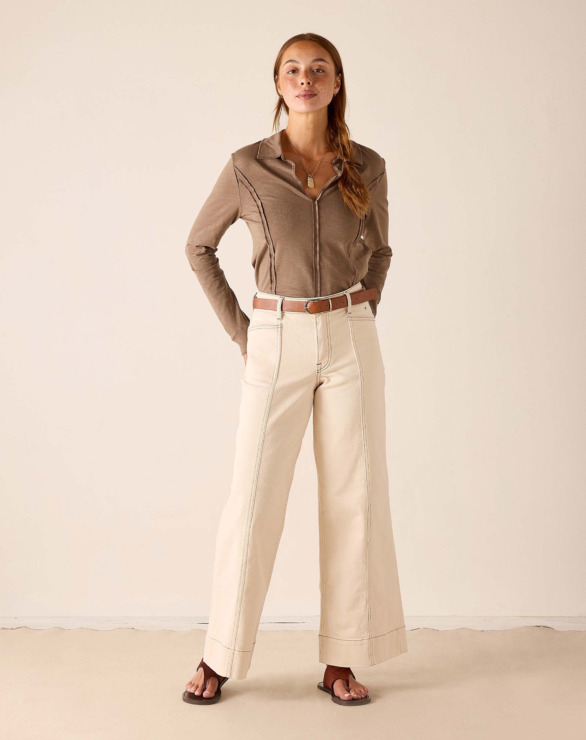 MERSEA ladies' travel-ready oat-colored wide-leg linen trousers with a subtle crease and matching belt.