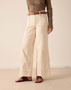 Oat wide-leg pants in a cotton blend featuring anded hem detail.