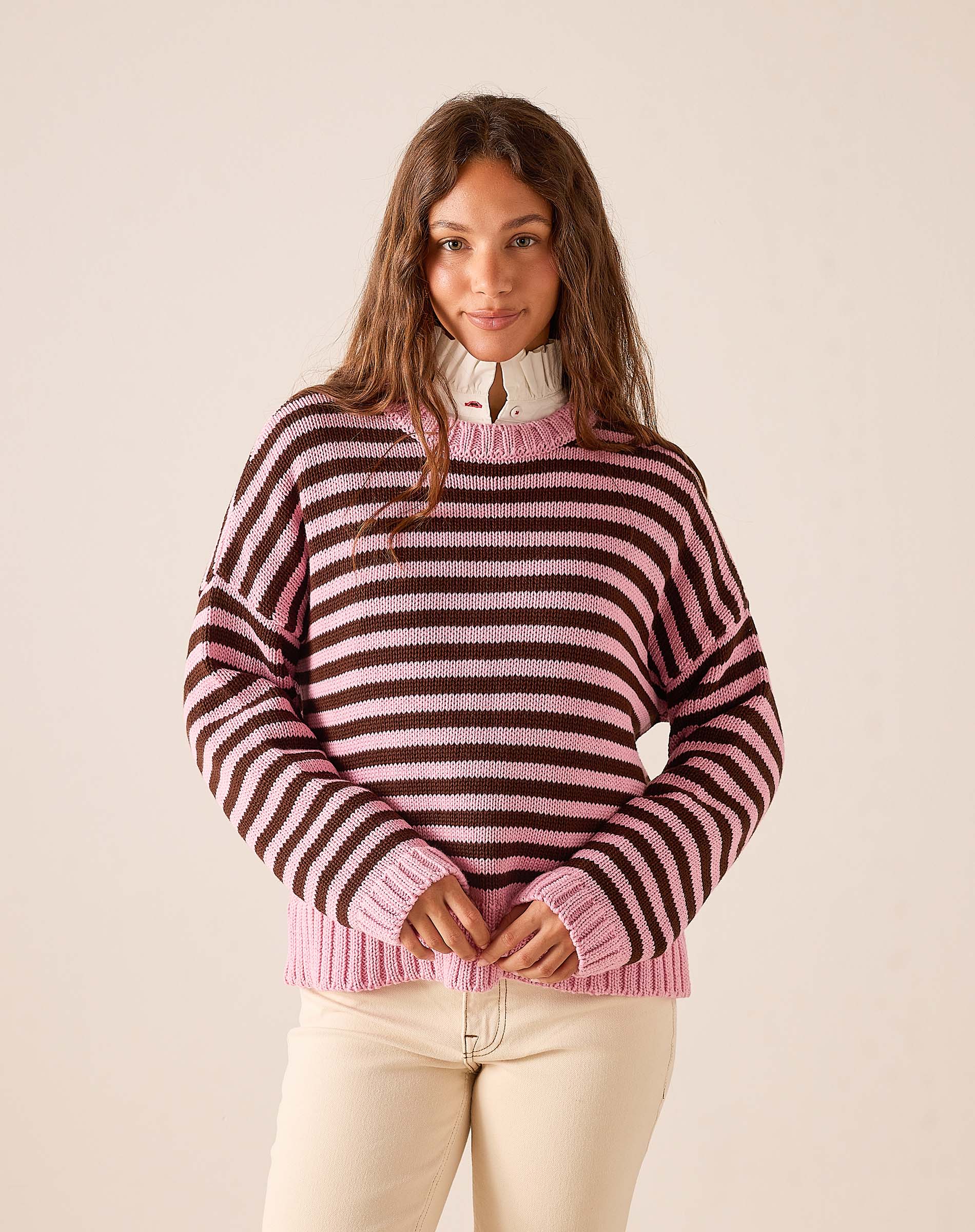 Ladies' travel-ready brown and pink striped cotton crewneck sweater with a relaxed fit and ribbed detailing.