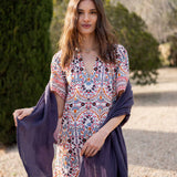 Multi-colored floral printed dress with short sleeves and a v-neckline.