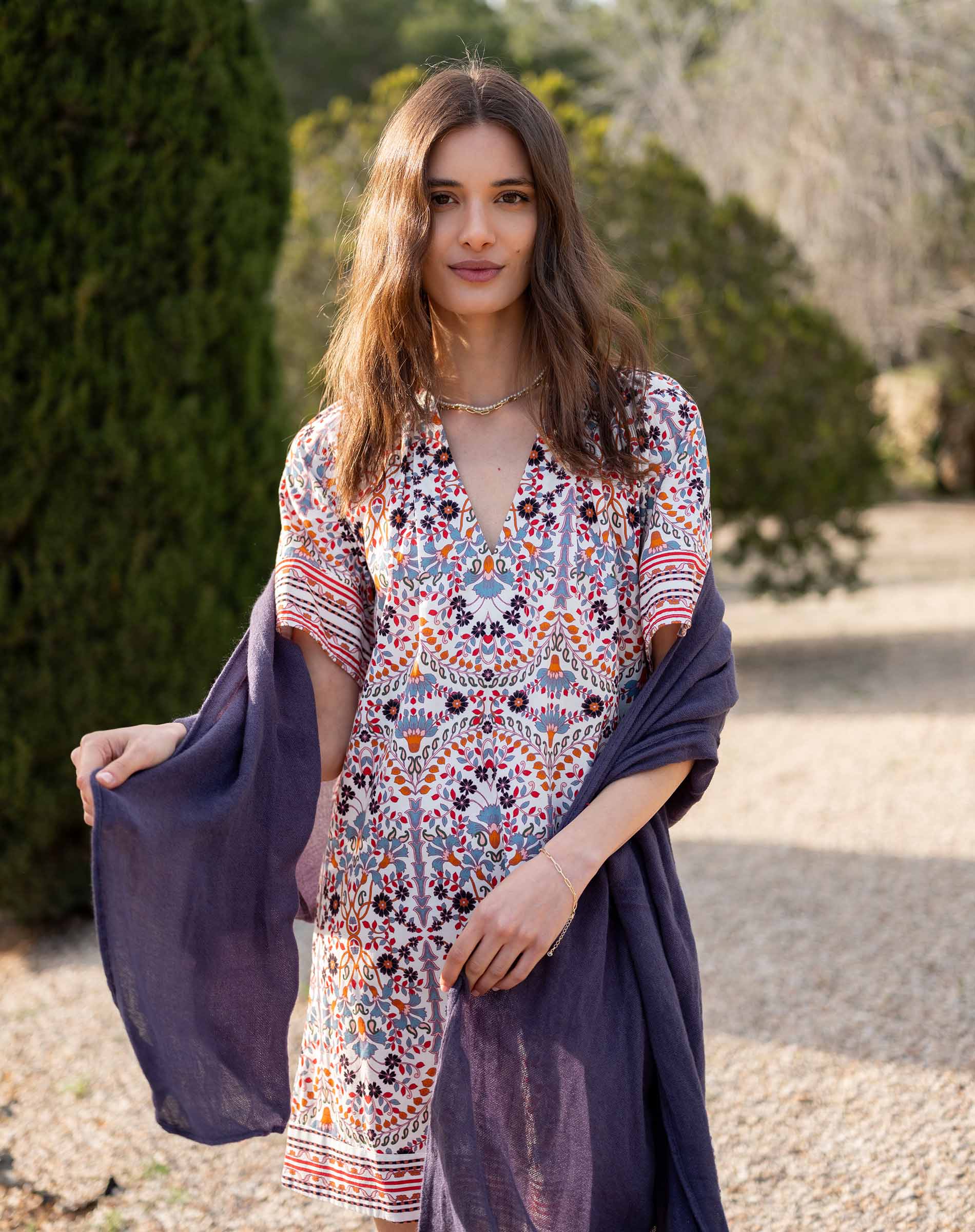 Multi-colored floral printed dress with short sleeves and a v-neckline.