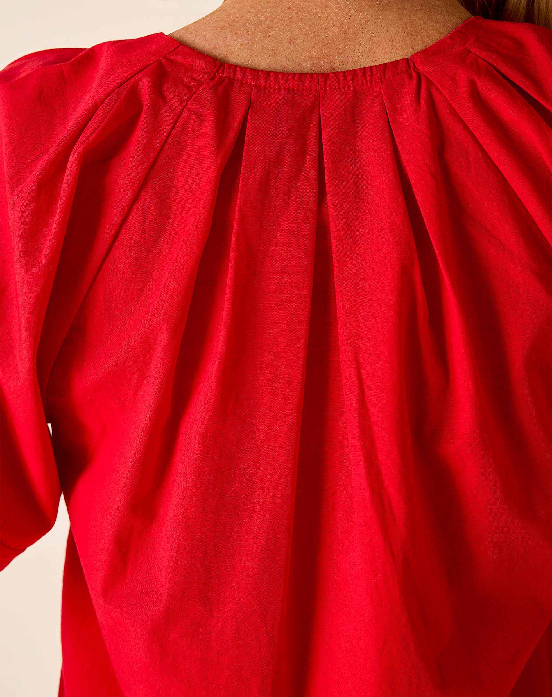 Close-up of a red garment with a plain background