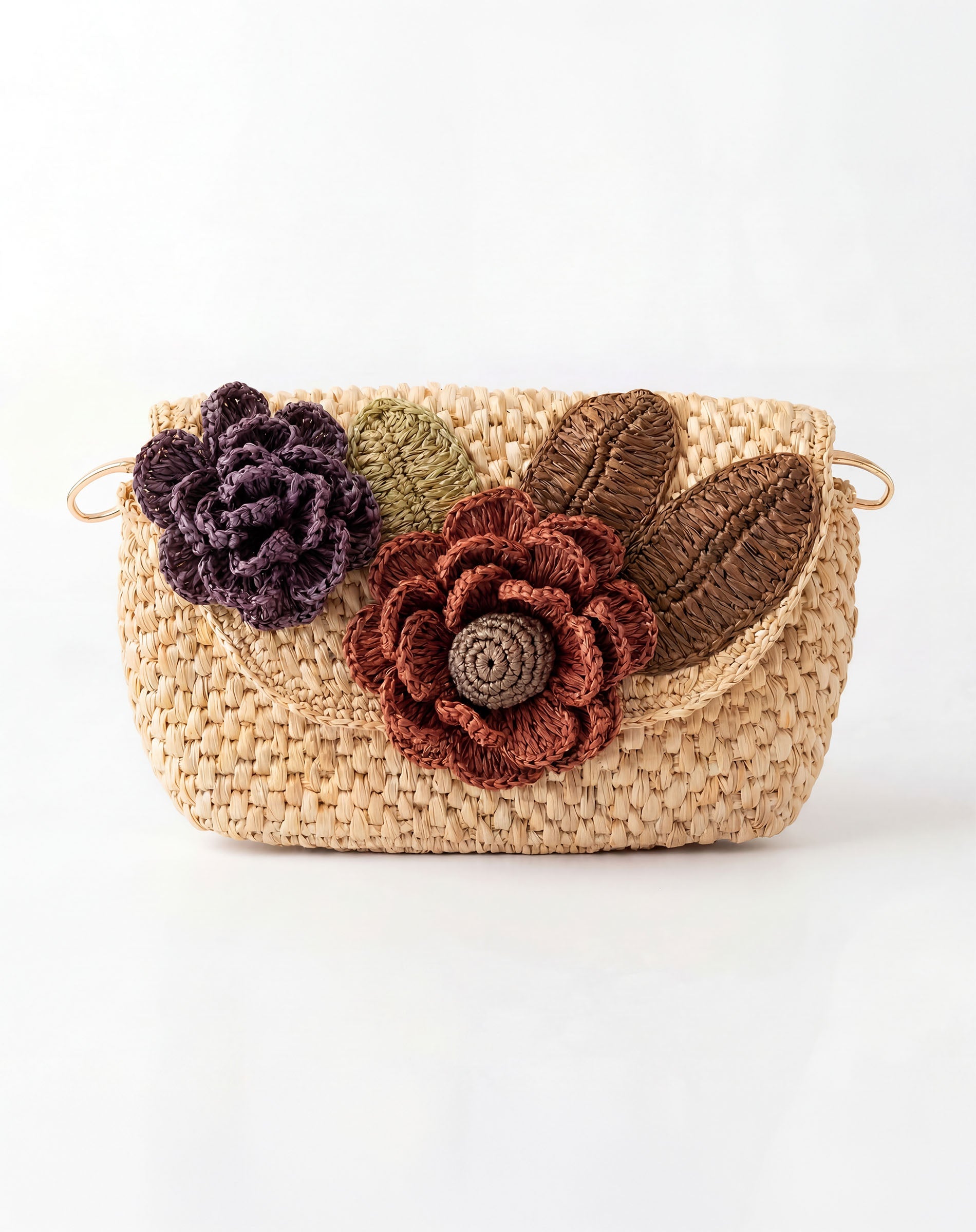 Woven handbag with floral embellishments on a white background