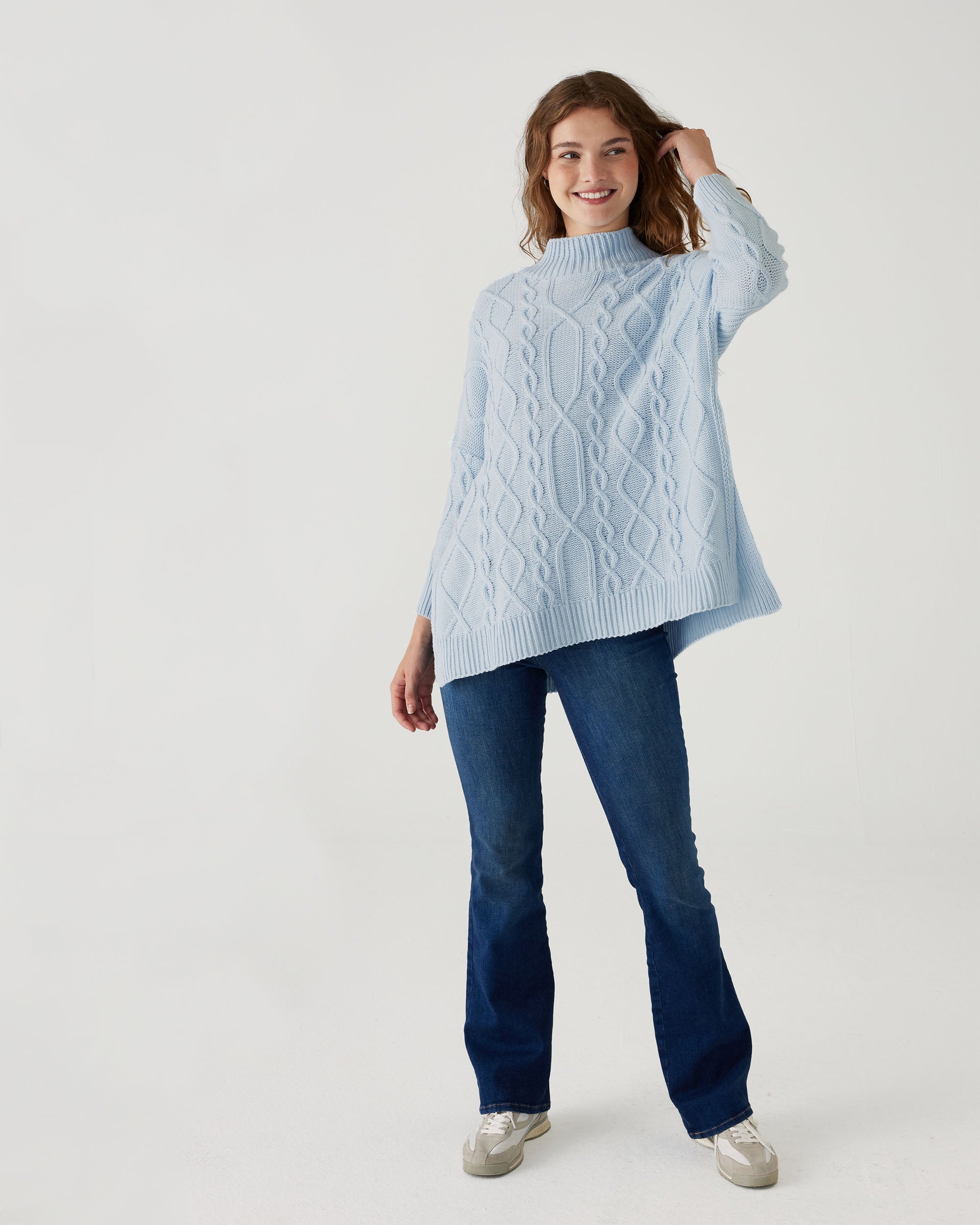 woman wearing Mersea lisbon sky blue sweater