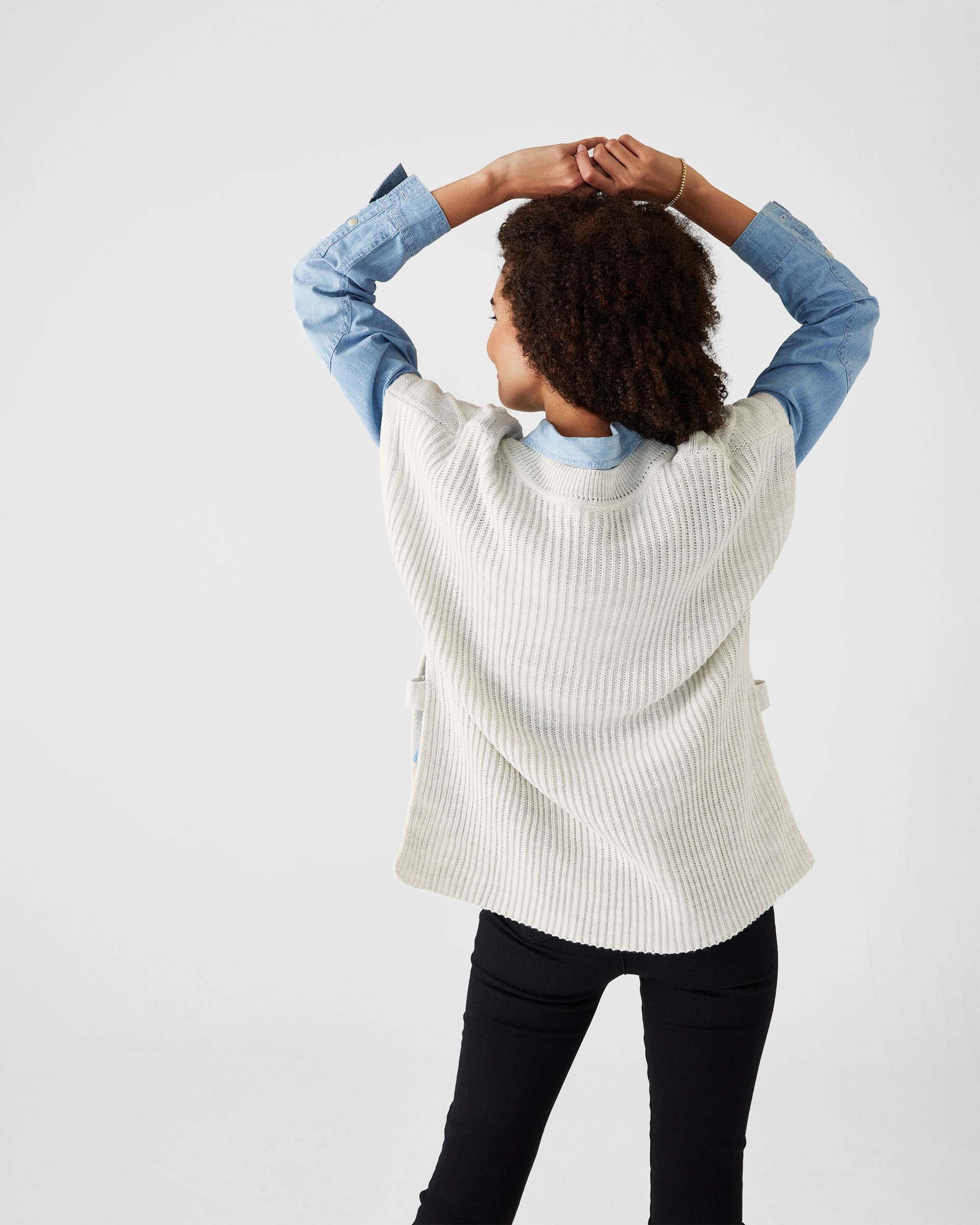 rearview of woman wearing Mersea lisbon sea salt lattice sweater