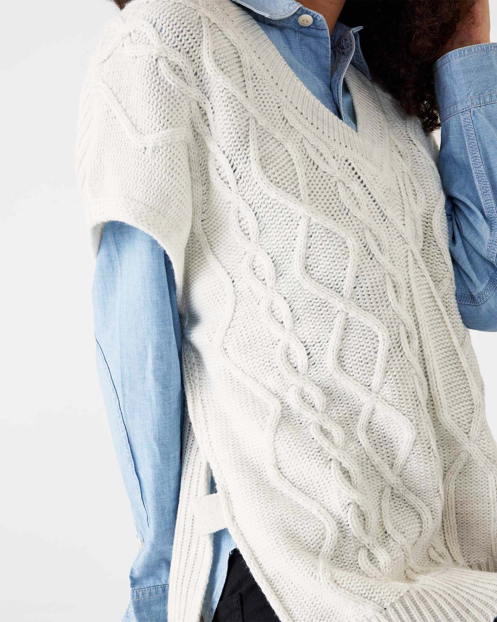 closeup of woman wearing Mersea lisbon sea salt lattice sweater