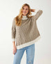 woman showcasing mersea lisbon traveler sweater in driftwood and seasalt