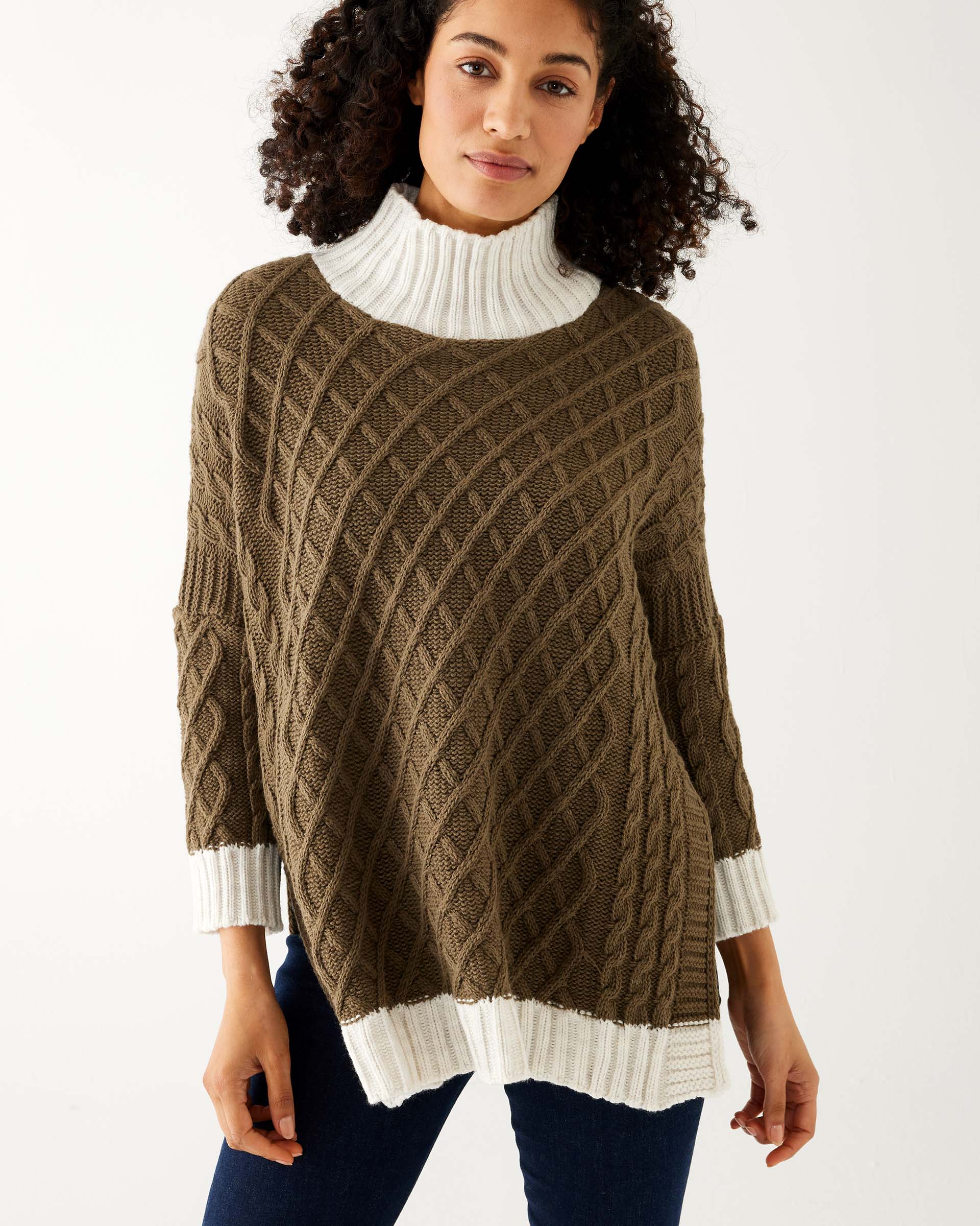 woman wearing mersea lisbon traveler sweater in olive and seasalt 