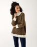 woman wearing mersea lisbon traveler sweater in olive and seasalt