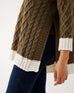 closeup of side split woman wearing mersea lisbon traveler sweater in olive and seasalt