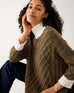 closeup of woman wearing mersea lisbon traveler sweater in olive and seasalt
