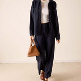 Navy blue heavy jersey knit pants with a wide leg silhouette.