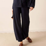 Navy blue heavy jersey knit wide-leg pants with a relaxed fit and straight hem.