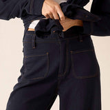 Navy blue heavy jersey pants featuring a high-waisted fit and functional front pockets.