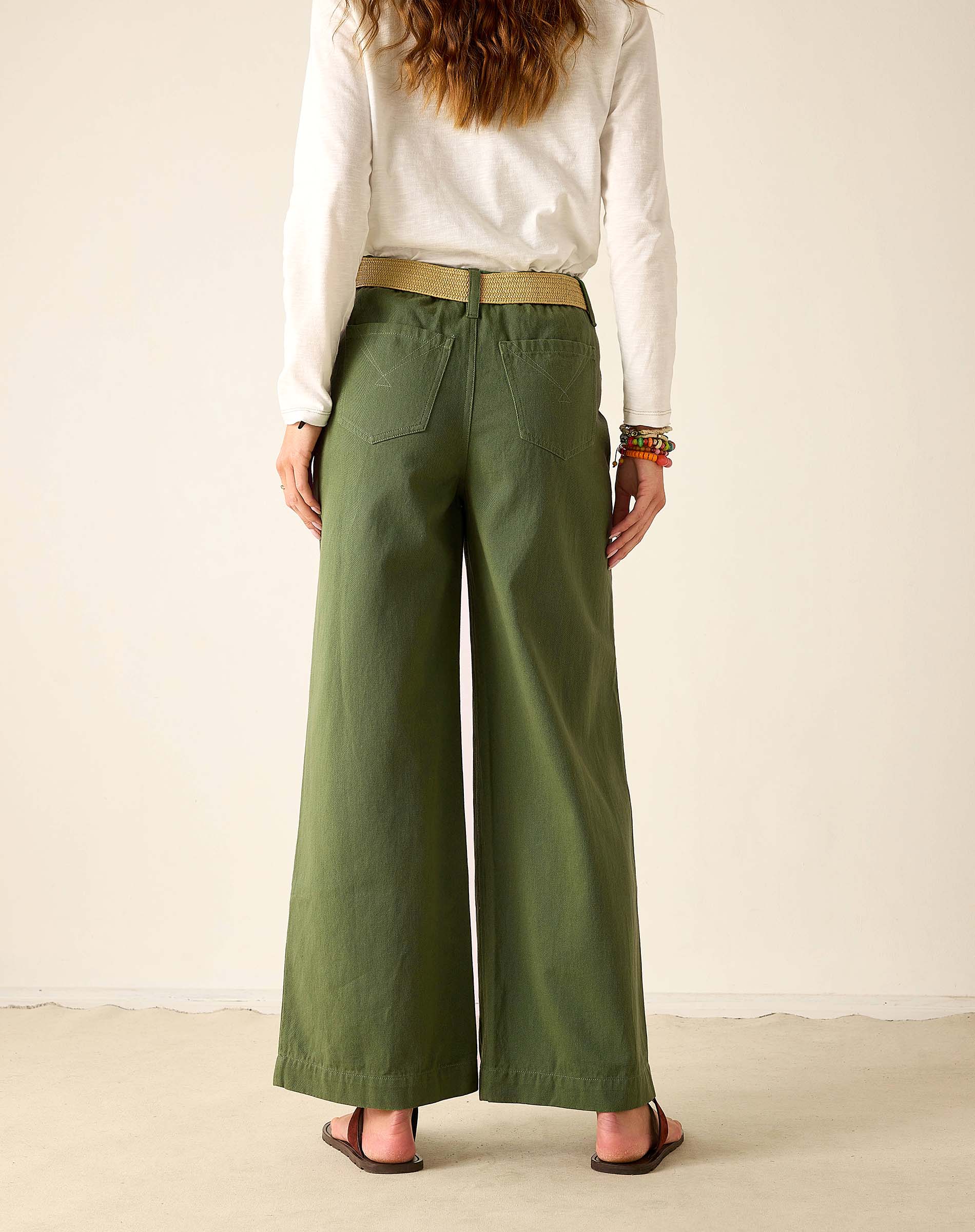 Olivine green twill wide-leg trousers with a high waist and flat front.