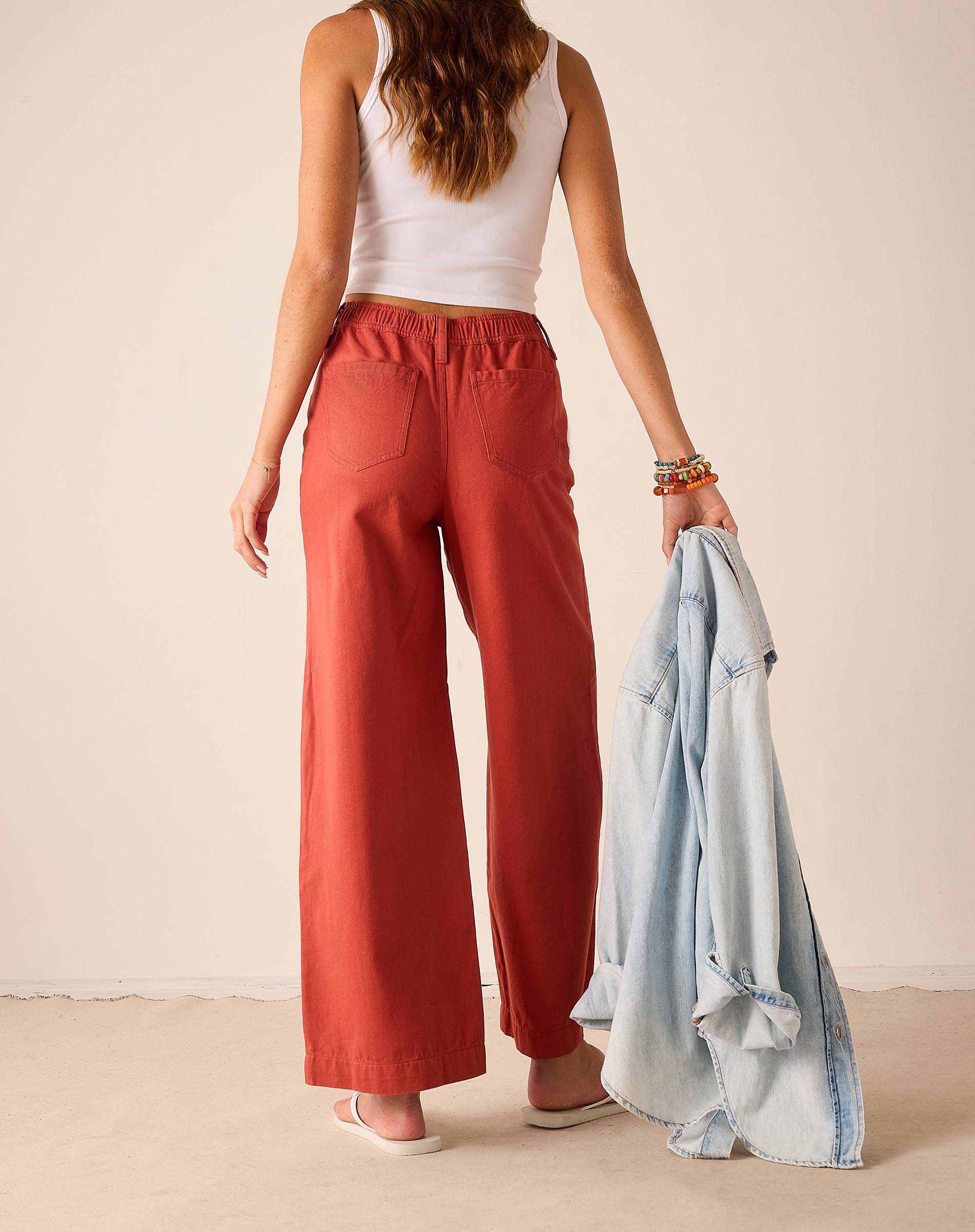 Persimmon twill wide-leg pants with an elastic waistband and front pockets.