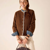 Ladies' travel-ready cocoa brown knit sweater with white eyelet lace trim and button details.