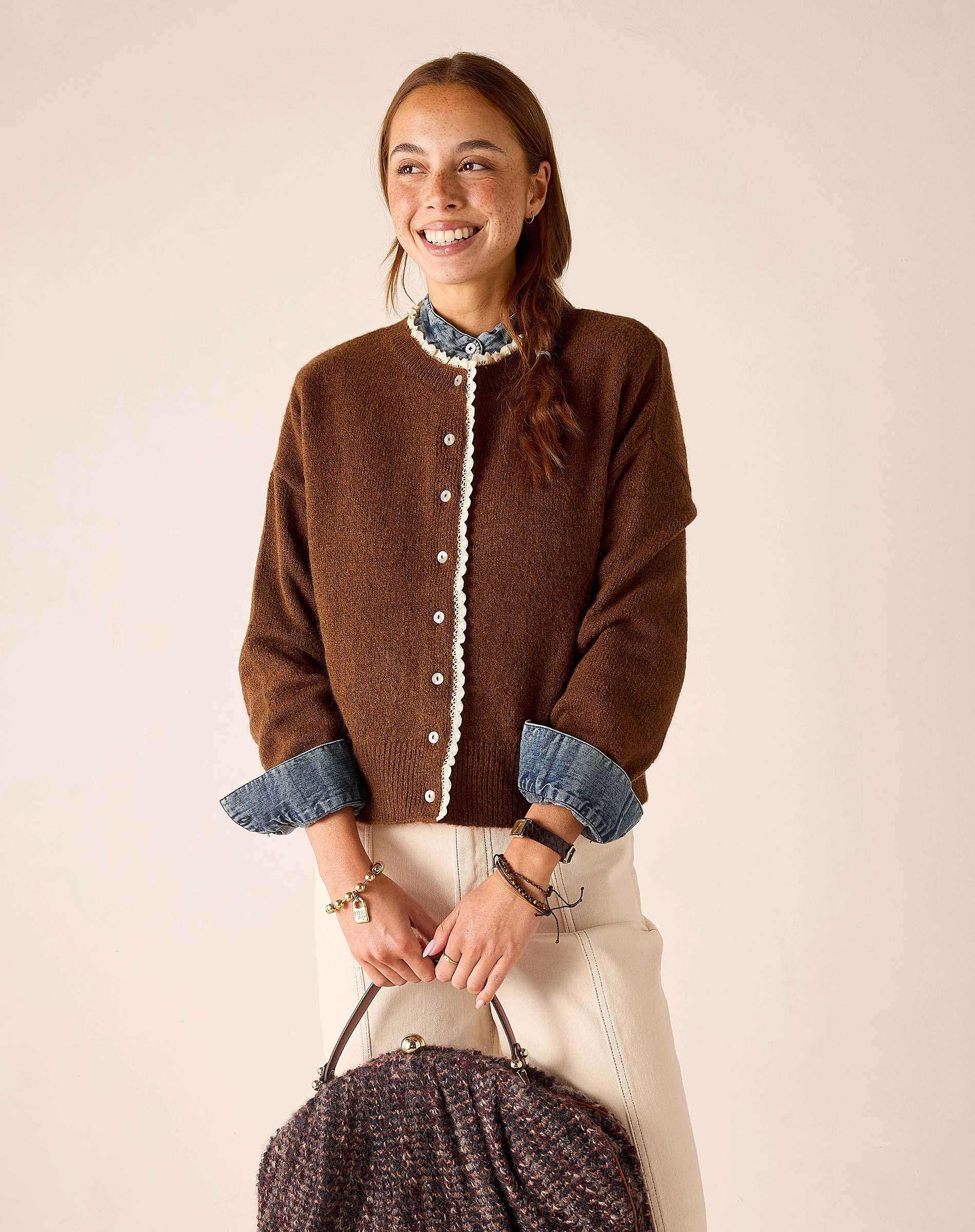 Ladies' travel-ready cocoa brown knit sweater with white eyelet lace trim and button details.