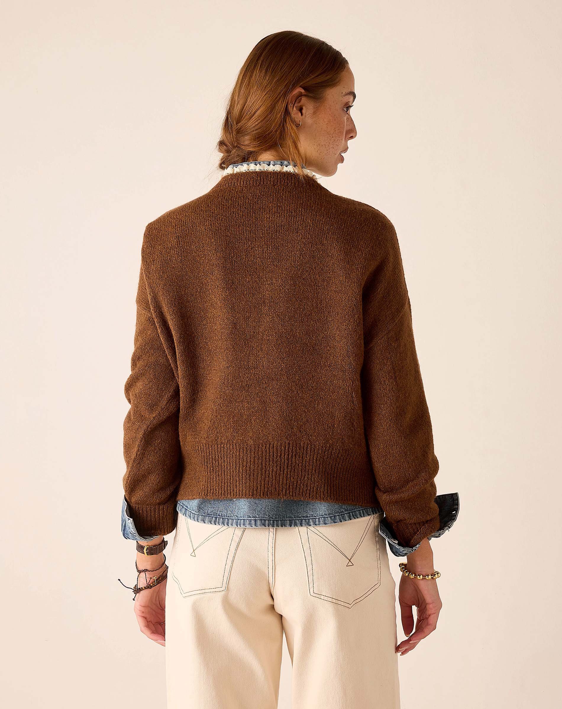 Cocoa brown knit sweater with a relaxed fit and soft texture.