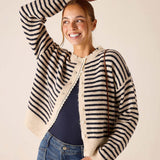 Cream and navy horizontal stripe knit cardigan with a scalloped edge.