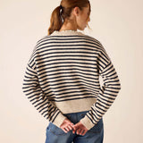 Navy and cream horizontal striped knit sweater with a relaxed fit and ribbed cuffs.