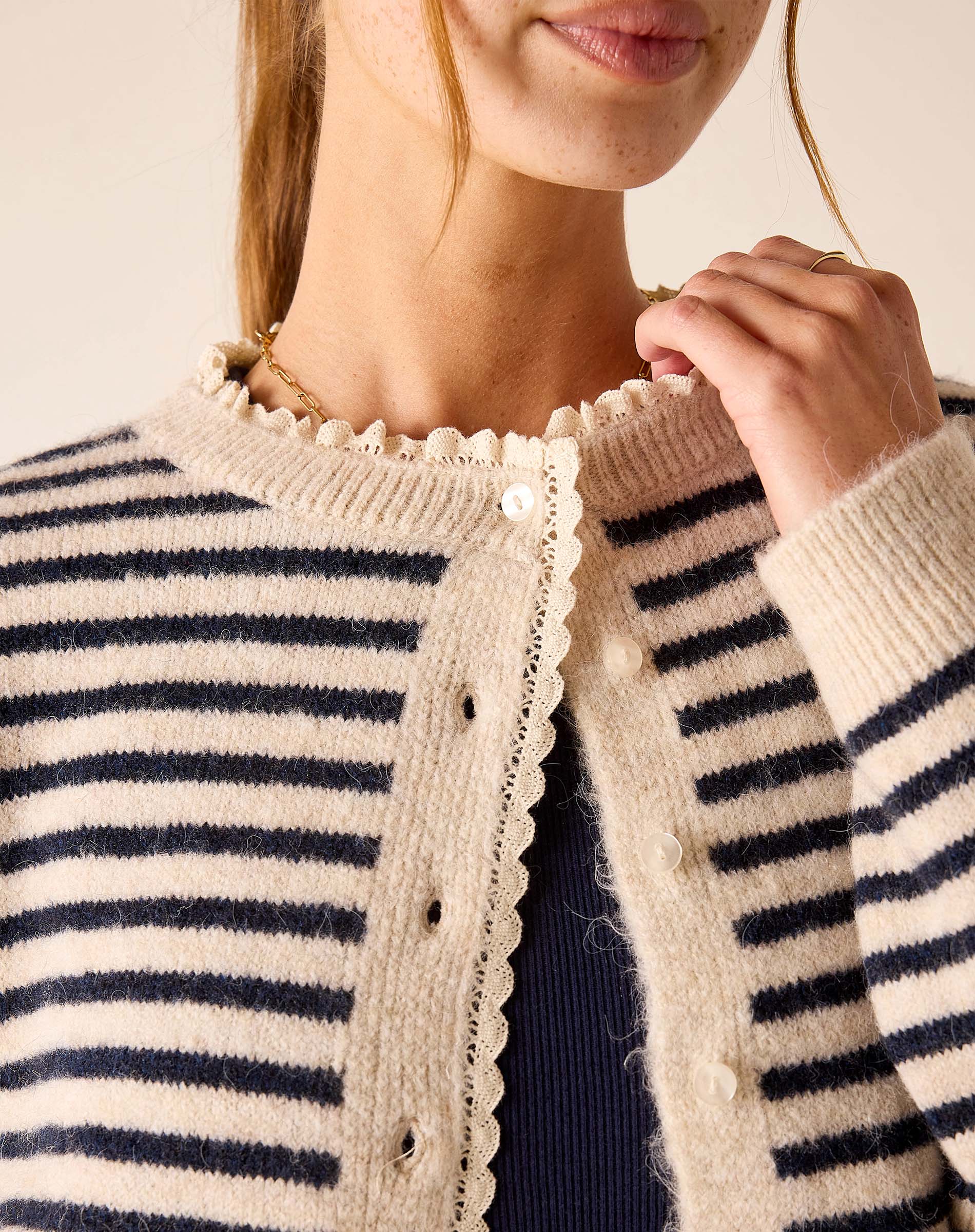 Sailor stripe knit sweater with scalloped lace trim and button front.