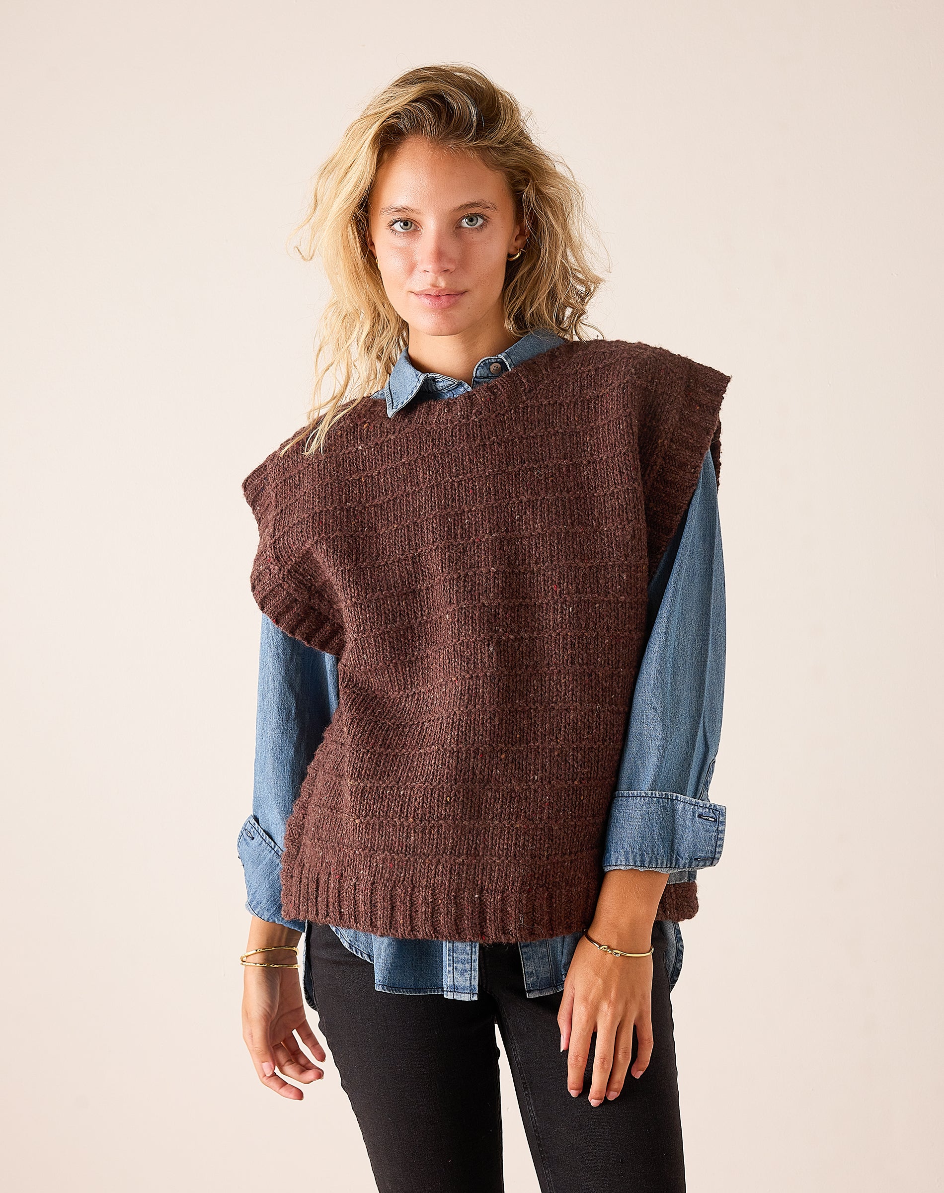 Women's travel-friendly chocolate brown knit sweater vest with a relaxed fit and chunky ribbed texture.