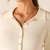 MERSEA women's travel-friendly creme ribbed knit button-down top with a notched collar.
