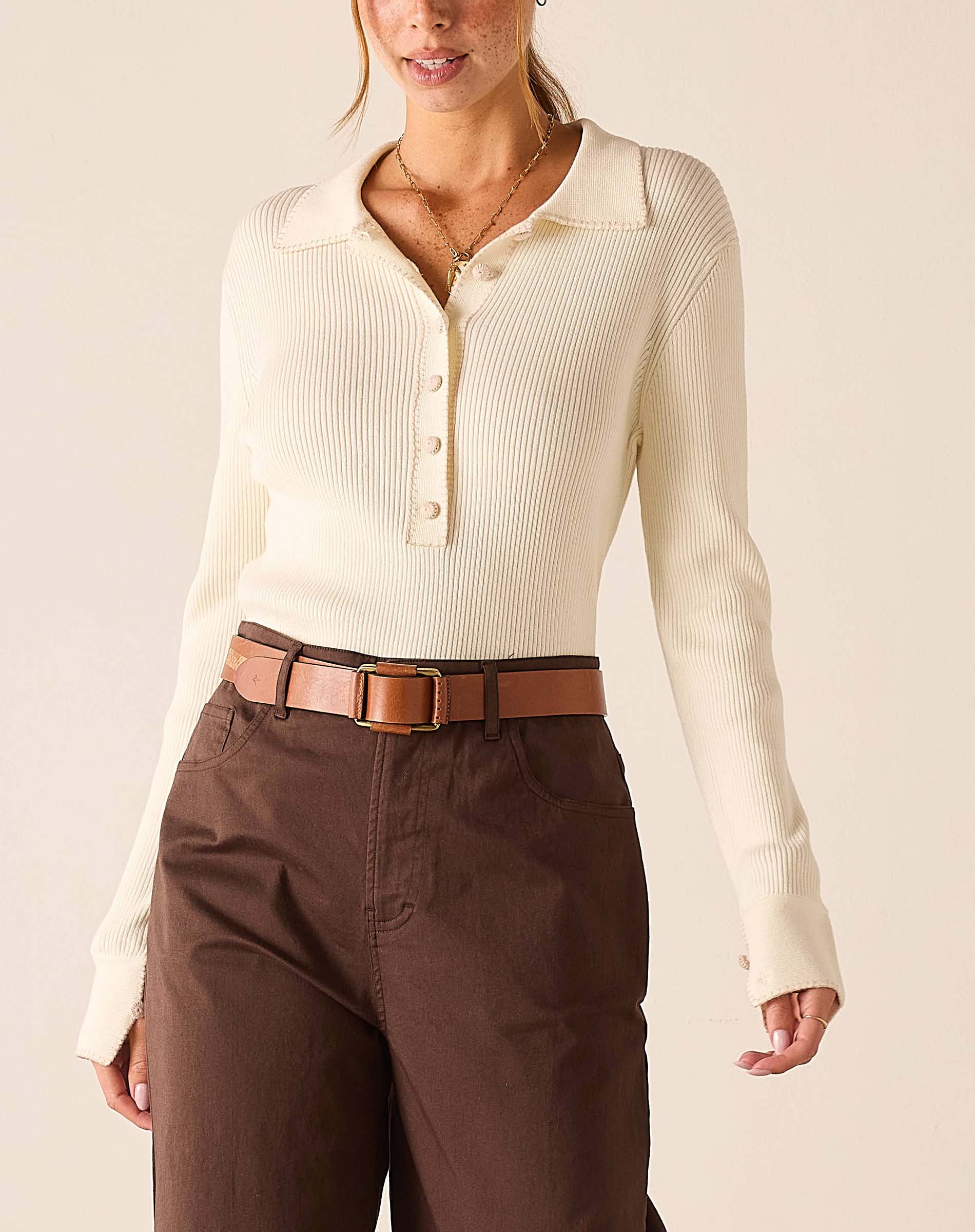 Crème ribbed long sleeve polo shirt.