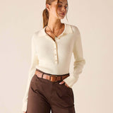 Creme ribbed long-sleeved polo top with button detail.