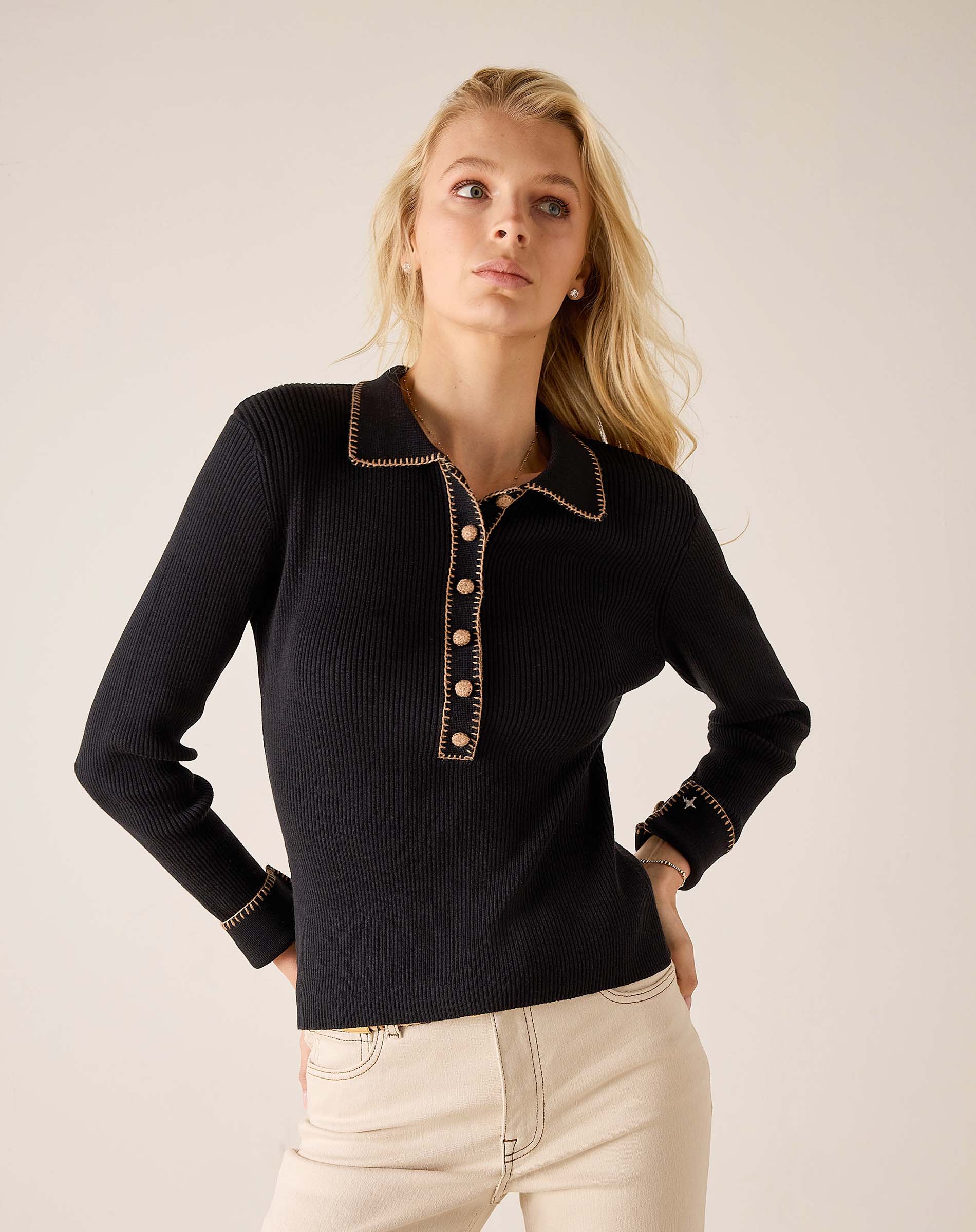 Women's travel-friendly ink black ribbed knit long sleeve polo with a contrast trimmed collar and button placket