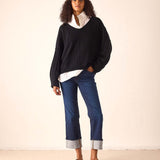 Black cashmere V-neck knit sweater with dropped shoulders and a relaxed fit.
