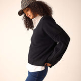 Black cashmere v-neck sweater with a relaxed fit and soft knit finish.