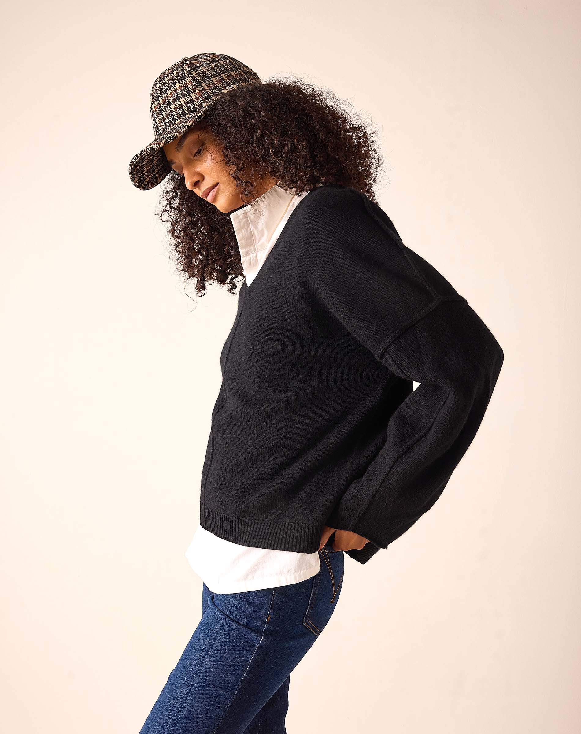 Black cashmere v-neck sweater with a relaxed fit and soft knit finish.