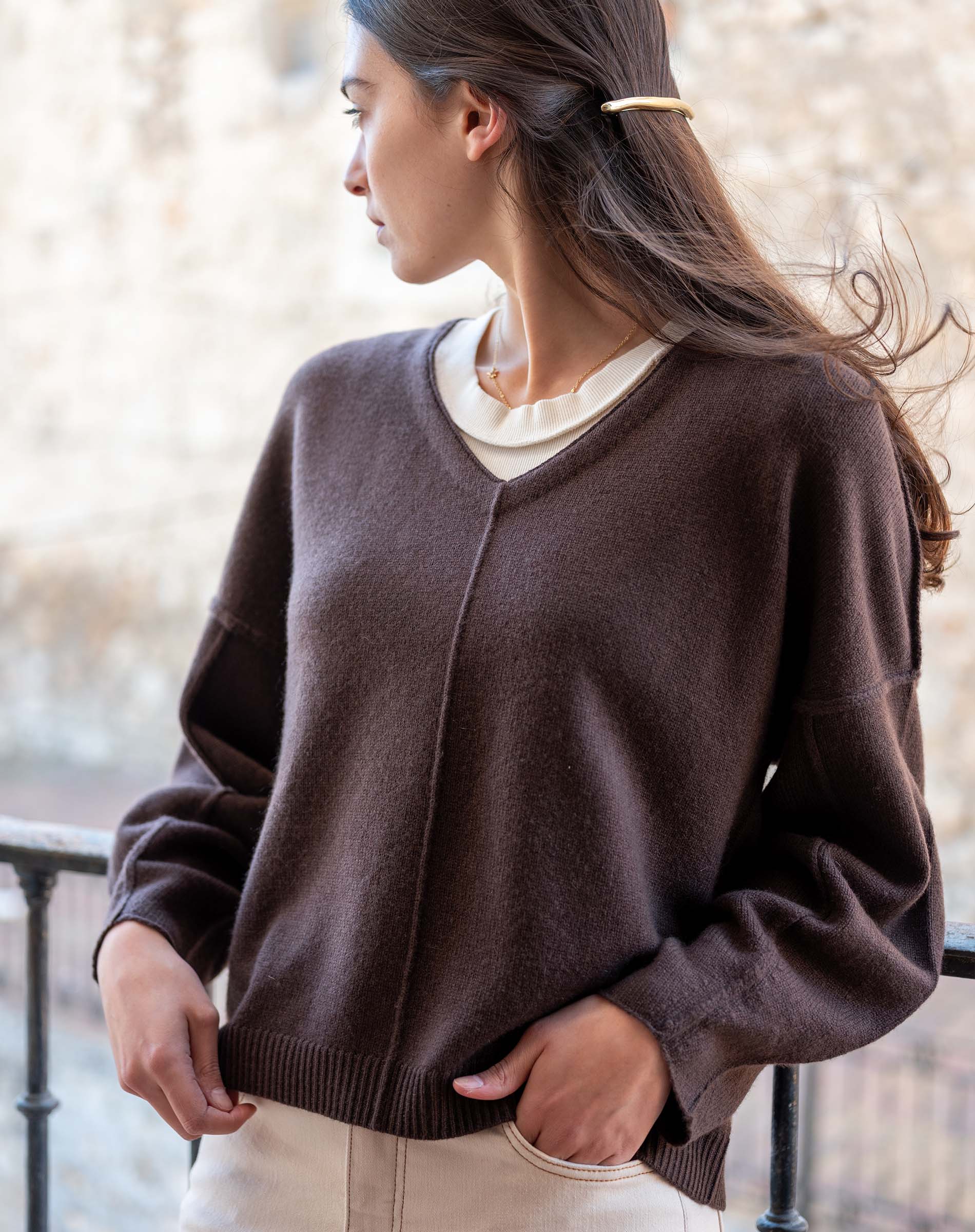 Truffle brown v-neck knit sweater with ribbed hem and cuffs.