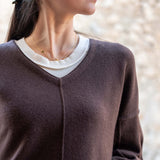 Truffle colored v-neck sweater with a soft knit finish.