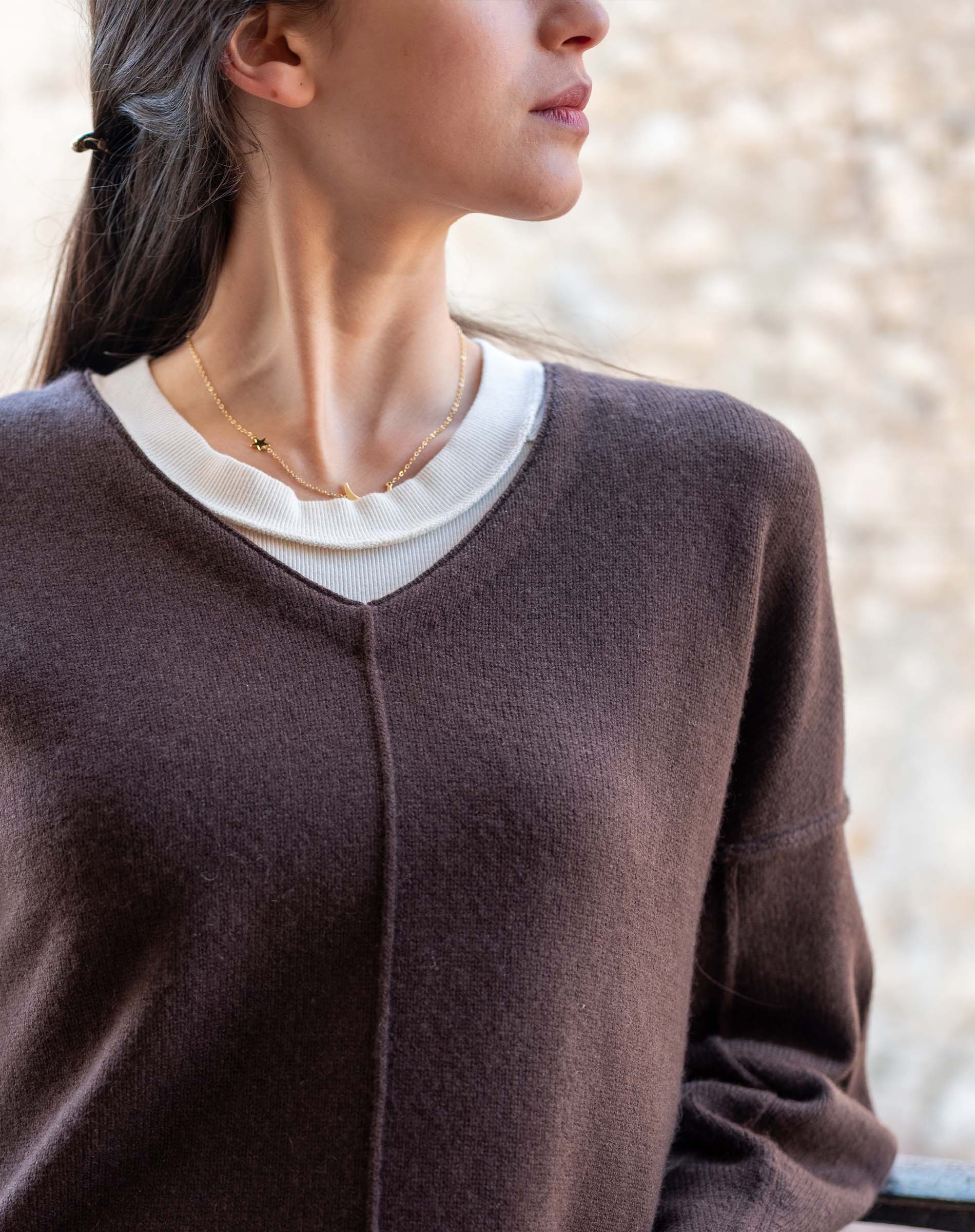 Truffle colored v-neck sweater with a soft knit finish.