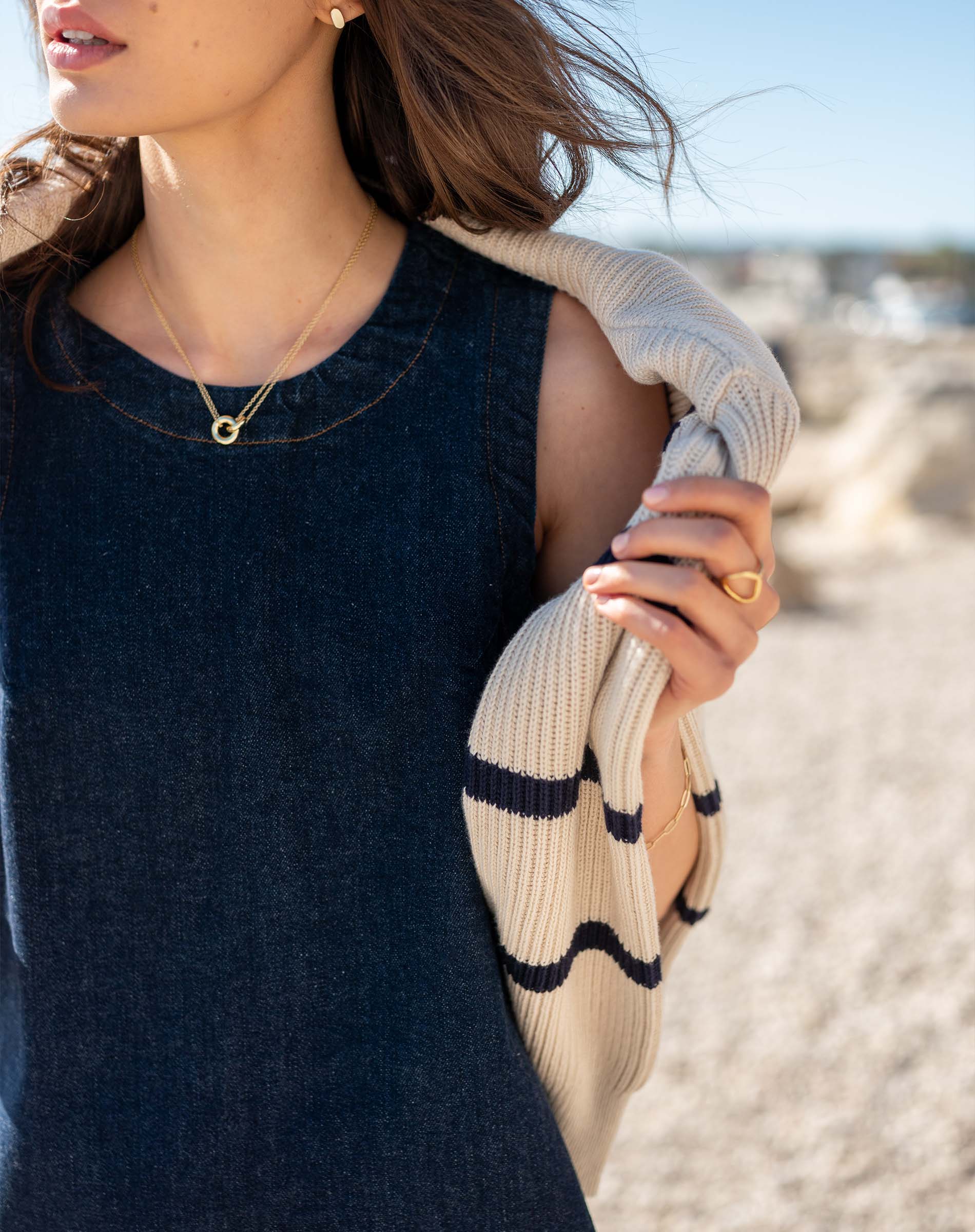 Midnight navy denim-texture dress with a textured knit wrap featuring striped patterns.