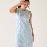 Clearwater twill dress in light blue with a frayed hem and vertical stripes.