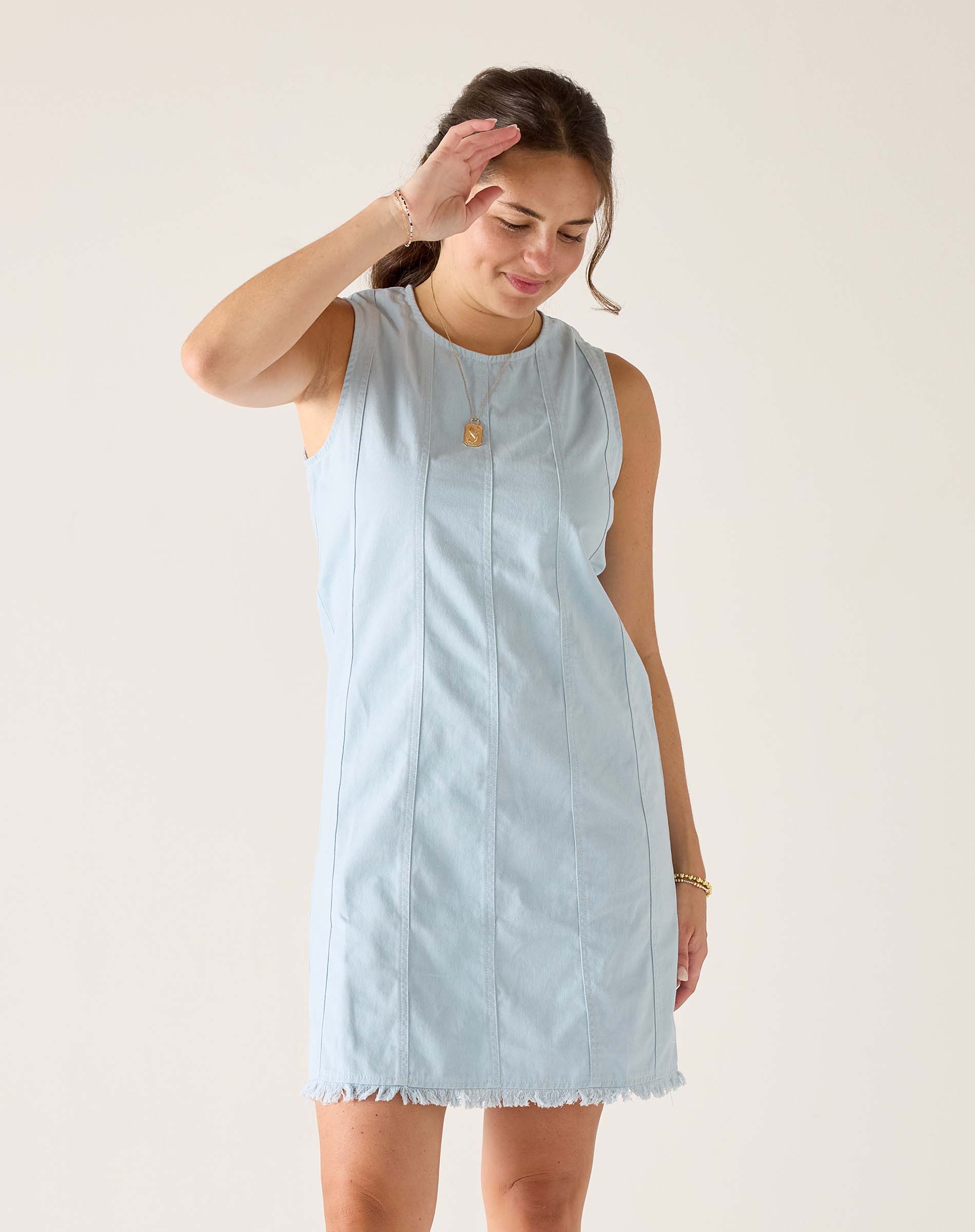 Clearwater twill dress in light blue with a frayed hem and vertical stripes.